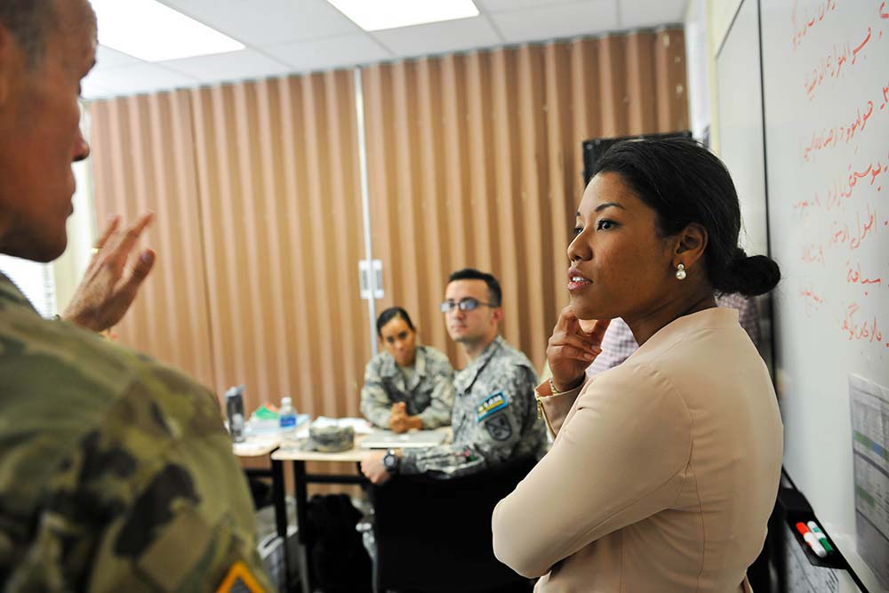 Ms. Banks listens to DLIFLC Commandant Col. Phil Deppert explain the intricacies of learning Modern Standard Arabic and the Iraqi dialect simultaneously. Though the task is daunting, DLIFLC students are able to rise to the challenge and pass the very challenging Defense Language Proficiency Test. These students will take their exam in just four weeks. (photo by Natela Cutter)