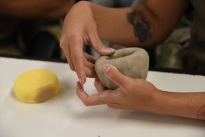 Learning language by doing with pottery