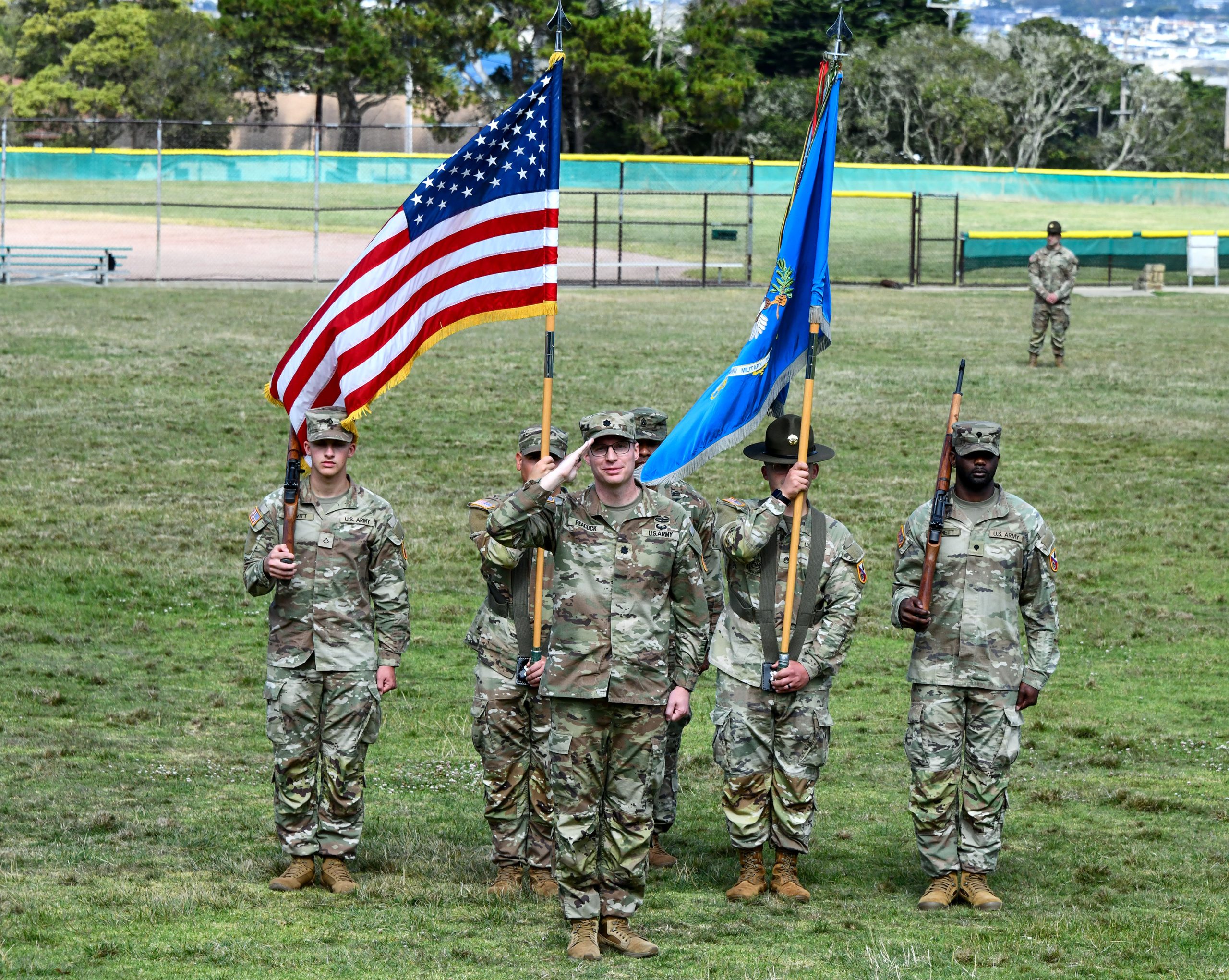 Incoming 229th MI Battalion Commander, incoming commander Lt. Col. Ryan Peacock, salutes on Soldier Field